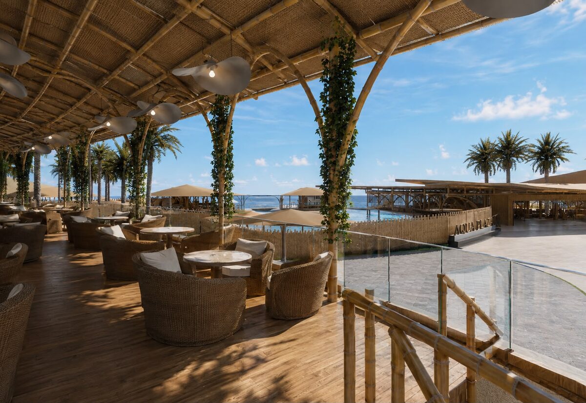 Terraza del restaurante de AQUALODGE con butacas de ratán y vista a la playa